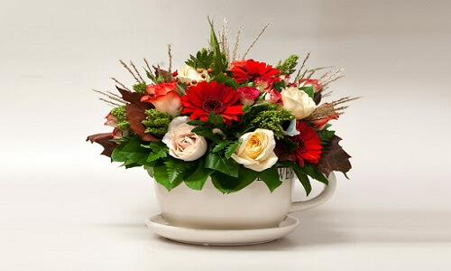 teacup and saucer flower arrangement